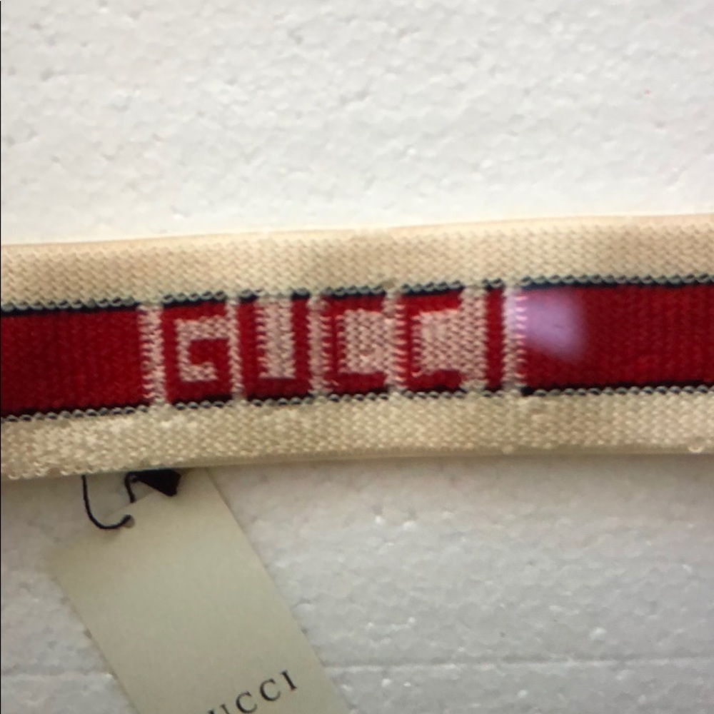 Black red and white elastic headband .